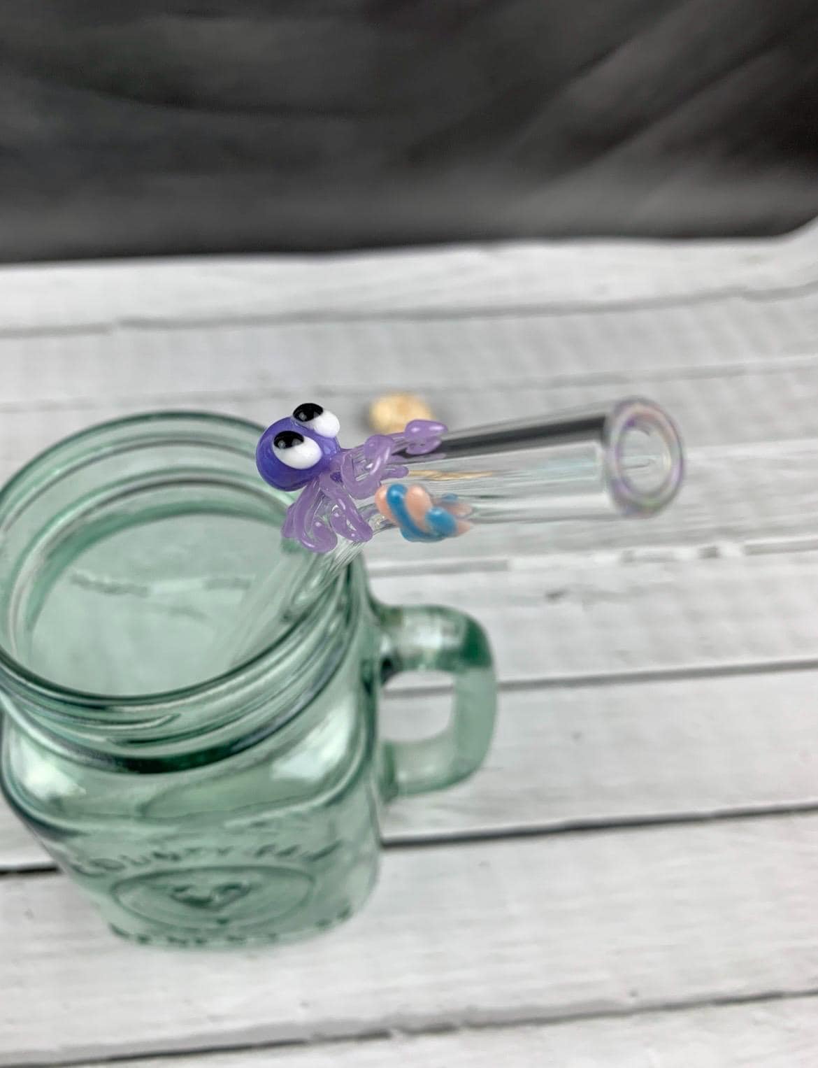 Purple Octopus and Shell on Bent Clear Glass Straw