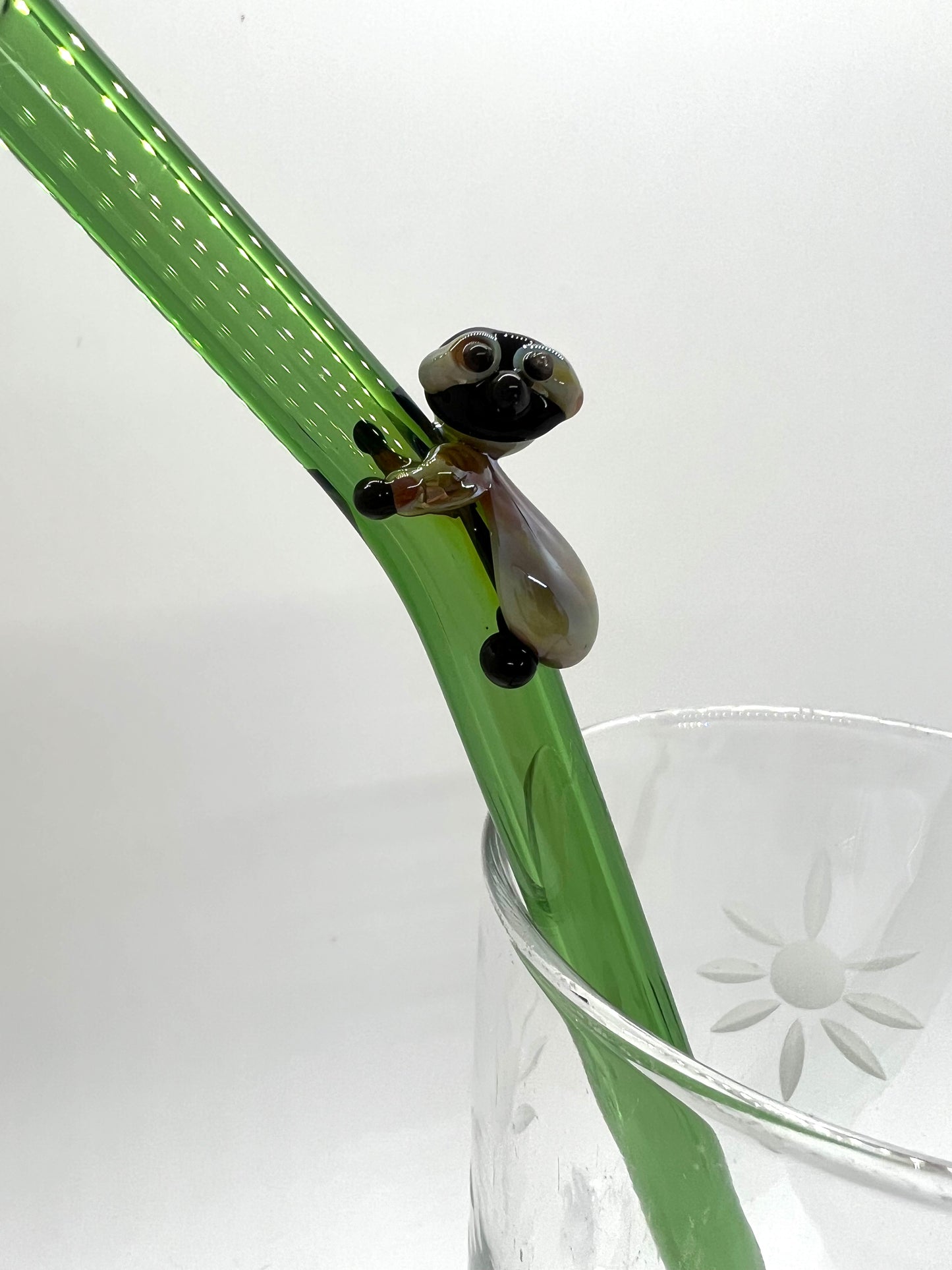 Sloth on Green Bent Straw