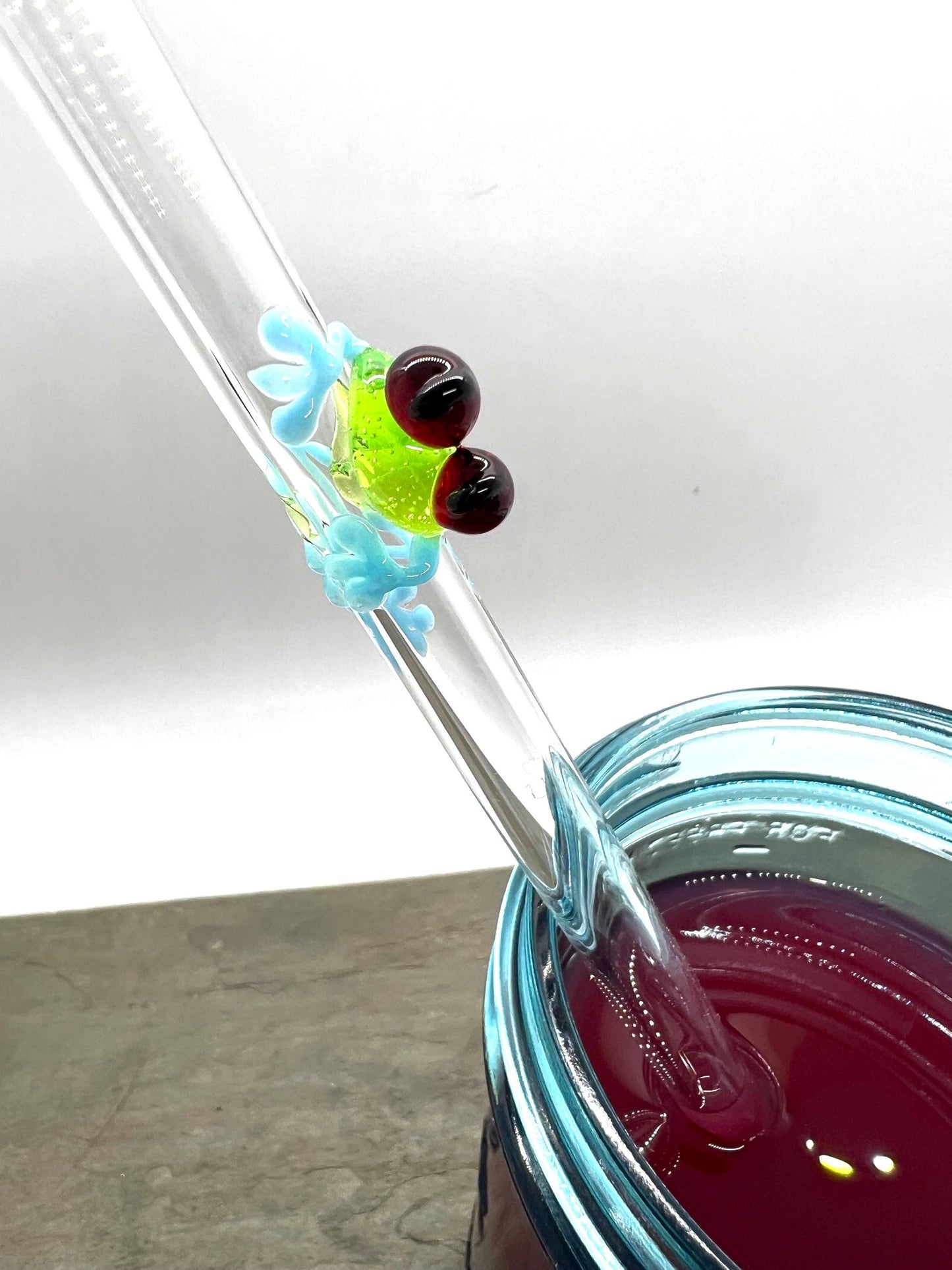 Tree Frog on Clear Glass Straw