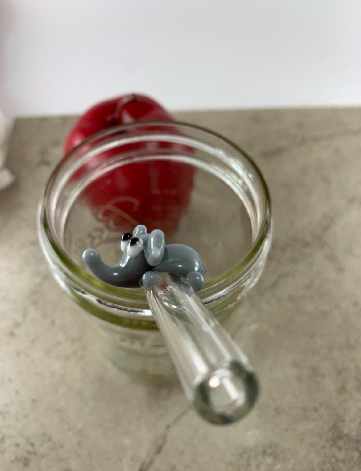 Gray Elephant on Bent Clear Glass Straw