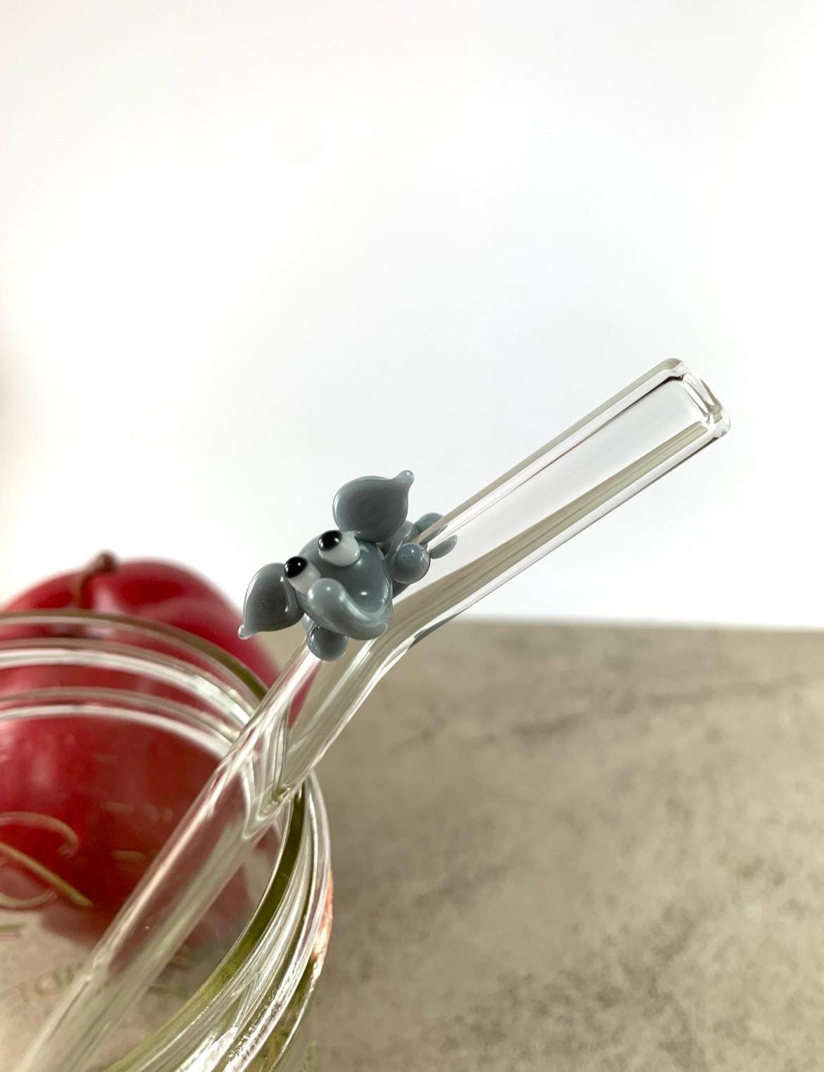 Gray Elephant on Bent Clear Glass Straw