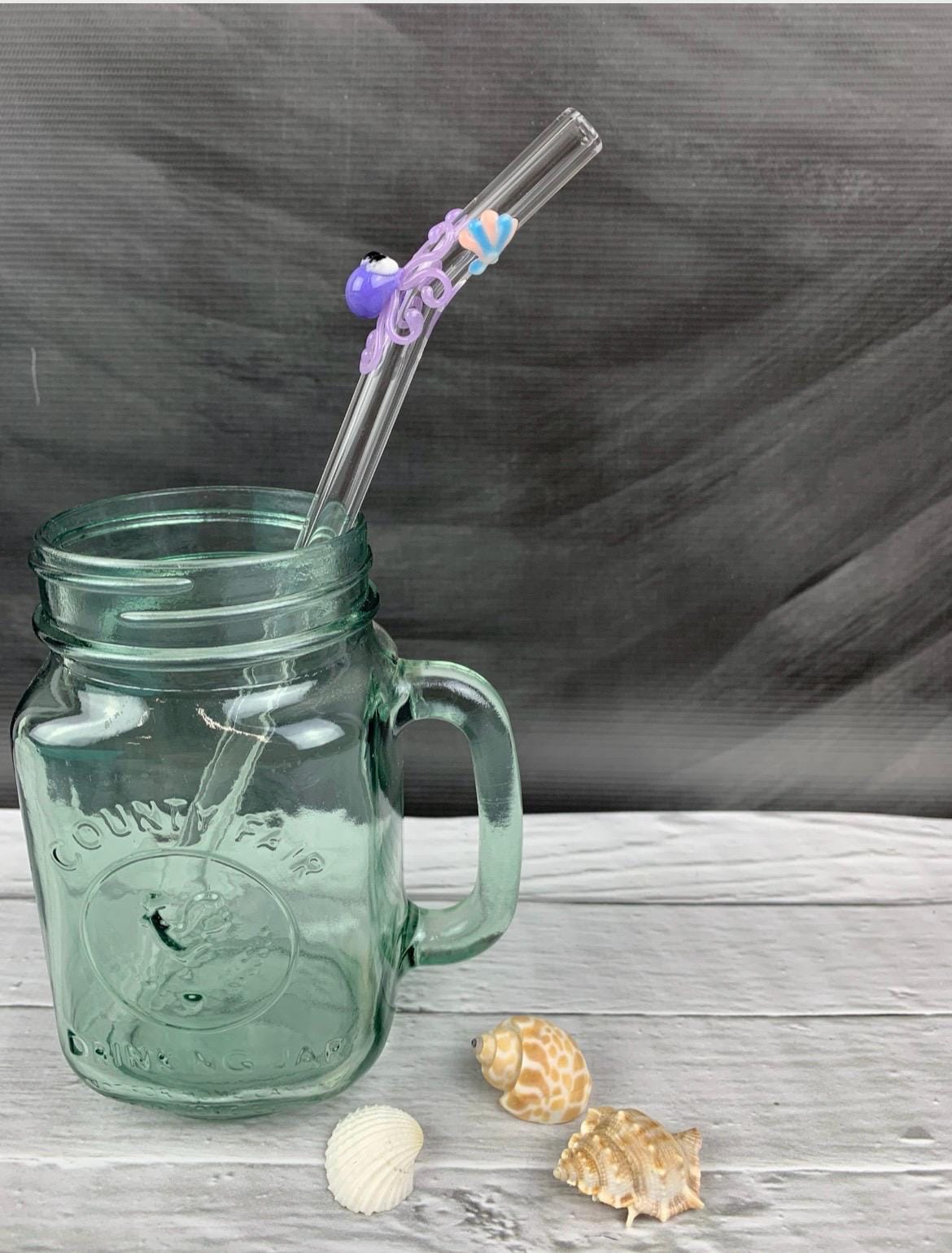 Purple Octopus and Shell on Bent Clear Glass Straw